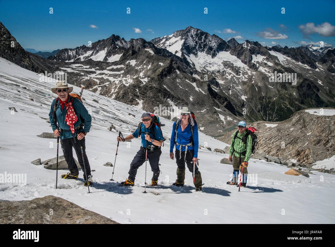 Trekking in the Zillertal seen here with mountaineers on ice remnants of the Stillupp Kees glacier Stock Photo