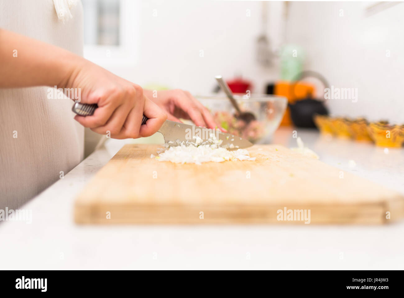 Female Hands Cutting Onion in the Kitchen Stock Photo Alamy
