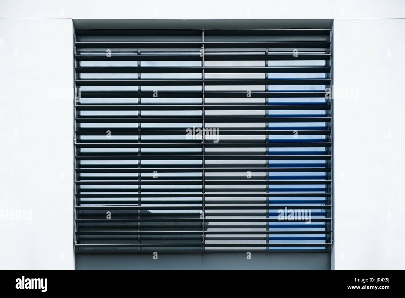 Abstract architectural detail window with grill Stock Photo - Alamy