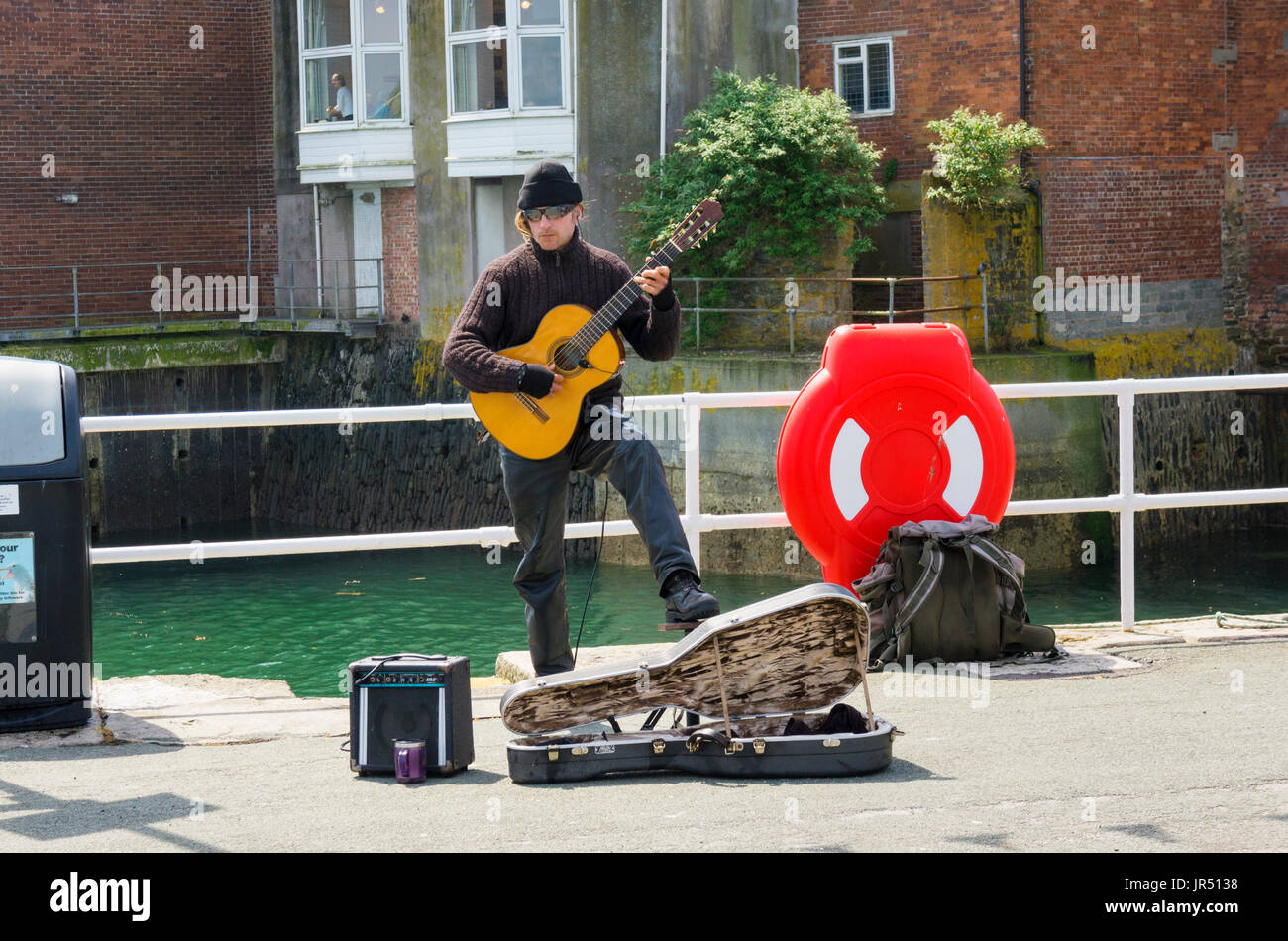 Busker, street performer, England, UK Stock Photo