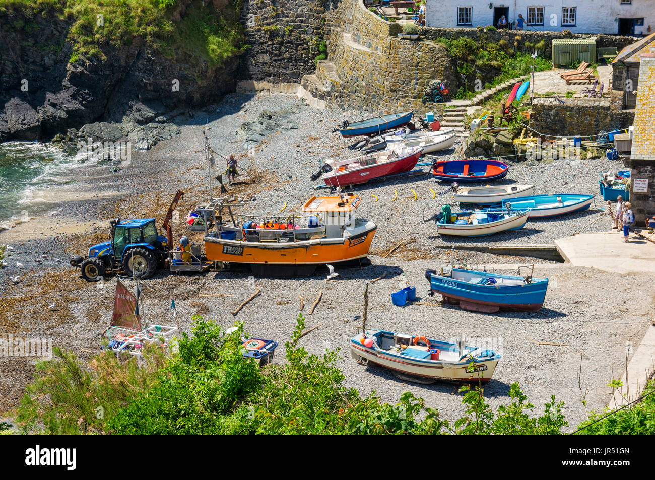 Fishing boats at Cadgwith Cove village, Lizard Peninsula, Cornwall, UK in summer Stock Photo