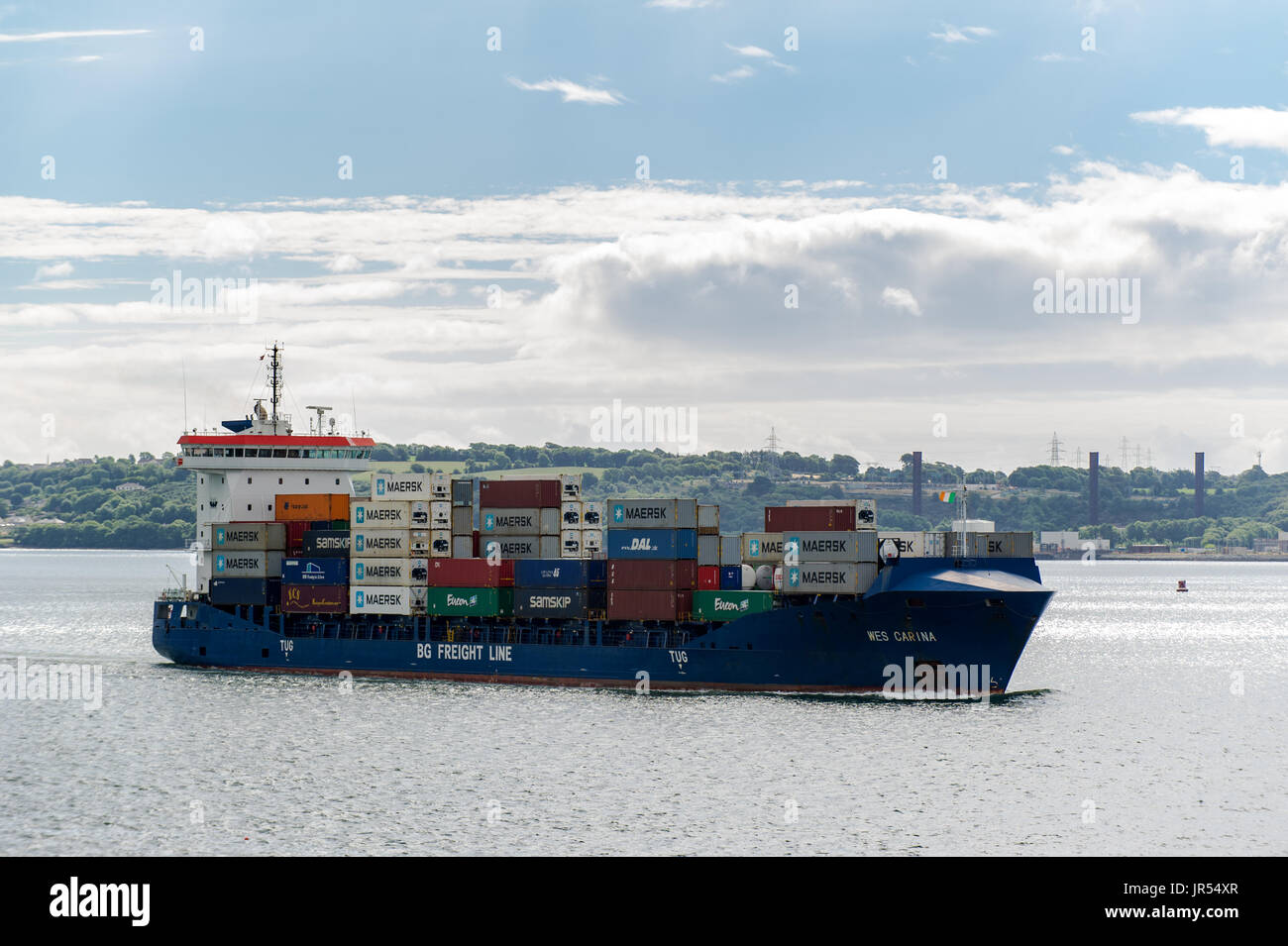 Container ship 'Wes Carina' of BG Freight Line sails through Cobh on her way to offload in Tivoli Docks, Cork, Ireland. Stock Photo