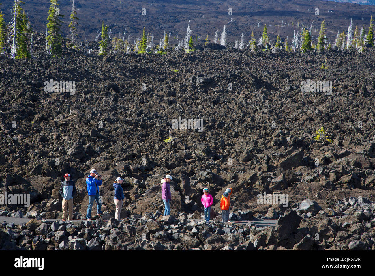 Hikers on Lava River National Recreation Trail, McKenzie Pass-Santiam Pass National Scenic Byway, Willamette National Forest, Oregon Stock Photo