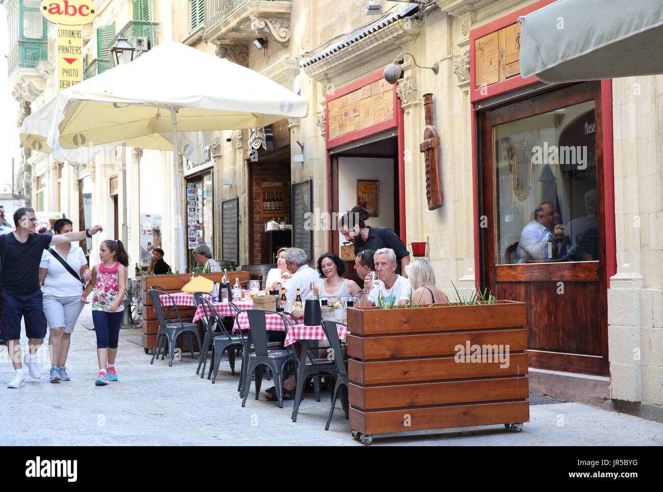 Cafes on South Street, in the heart of Valletta, capital of Malta Stock Photo Alamy