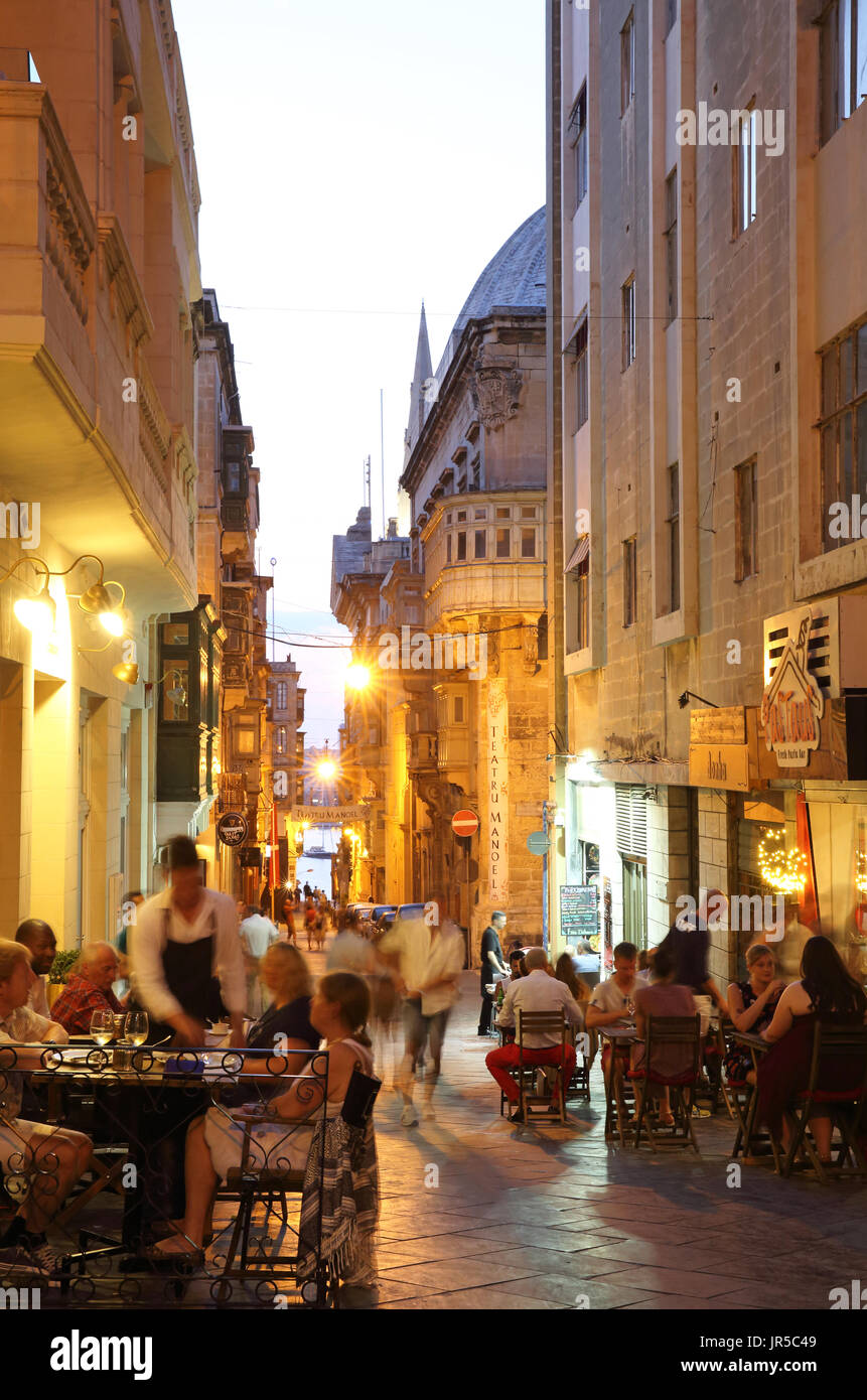 Restaurants on Old Theatre Street in the evening, in Valletta, Malta Stock Photo