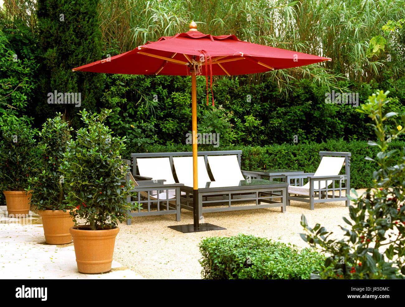 Garden table and chairs umbrella hires stock photography and images