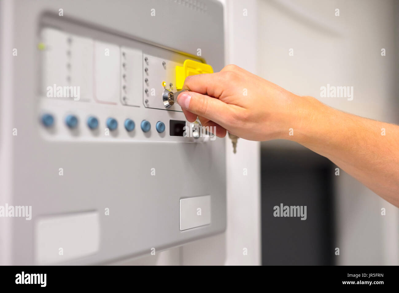 IT Engineer Using Key To Open Fire Panel In Datacenter Stock Photo Alamy