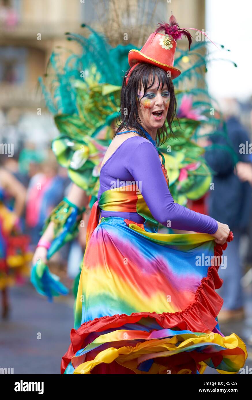 Colourful carnival parade through the streets of Bath in Somerset, United Kingdom as part of the celebrations for the London 2012 para olympics. Stock Photo