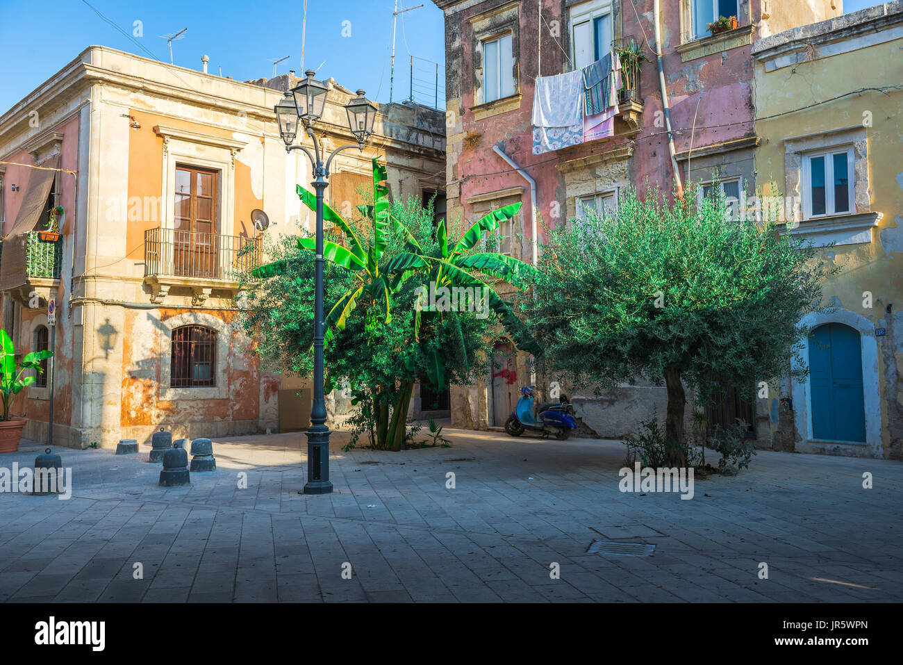 Ortigia Sicily old town, view in summer of a small enclosed piazza in the historic old town quarter of Ortigia, Syracuse (Siracusa), Sicily. Stock Photo