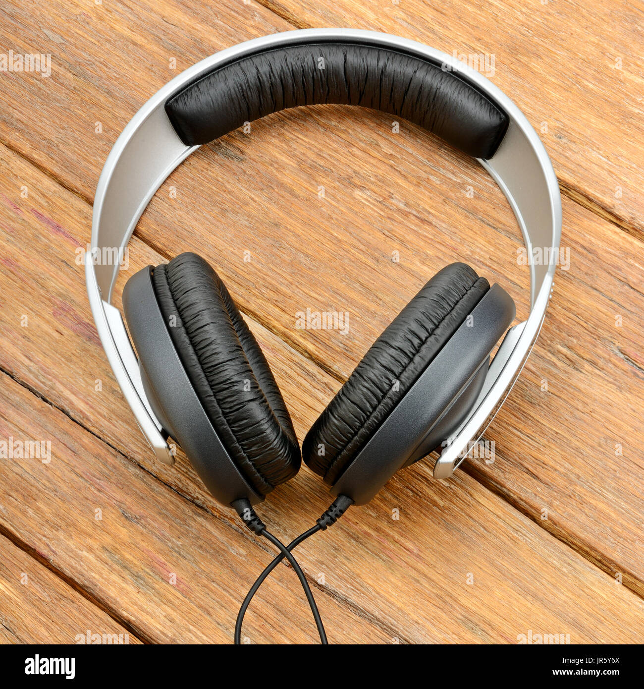 Big headphones on wooden table Stock Photo