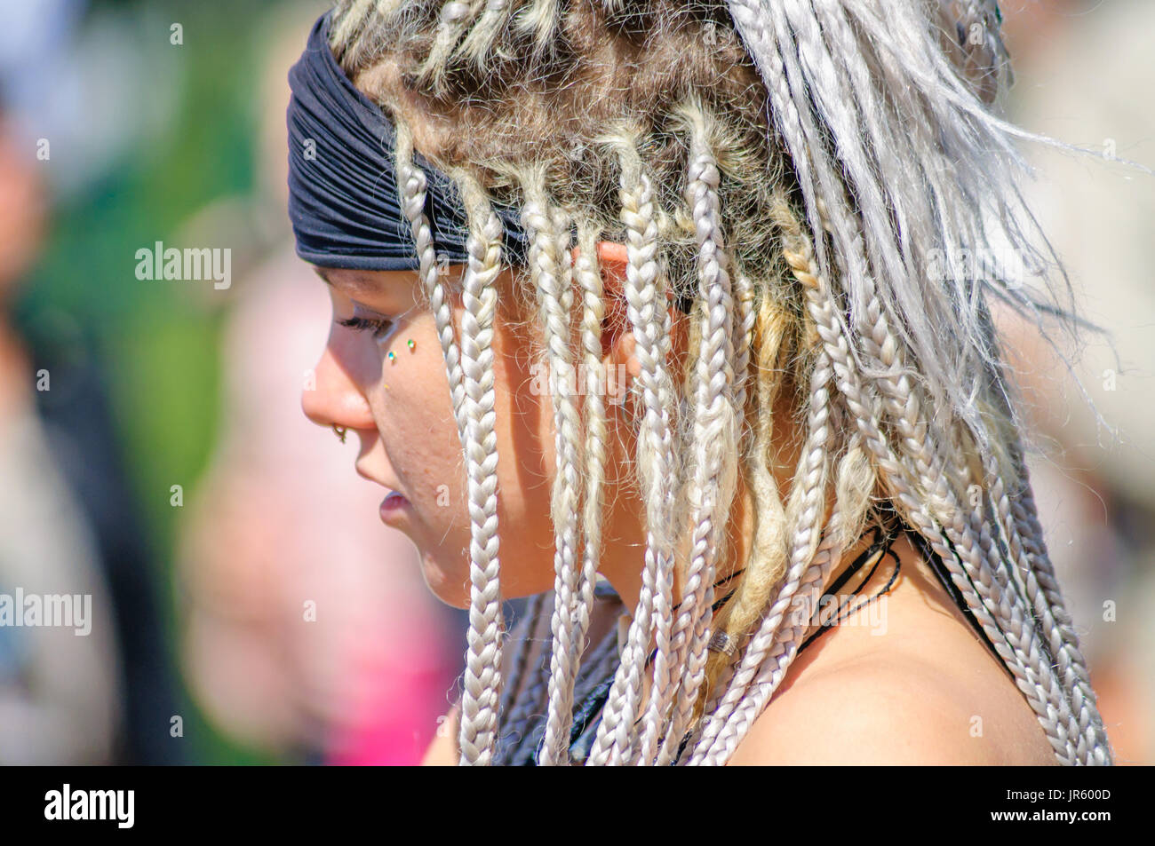 Female Performer Wearing A Headband With Braided Dreadlock