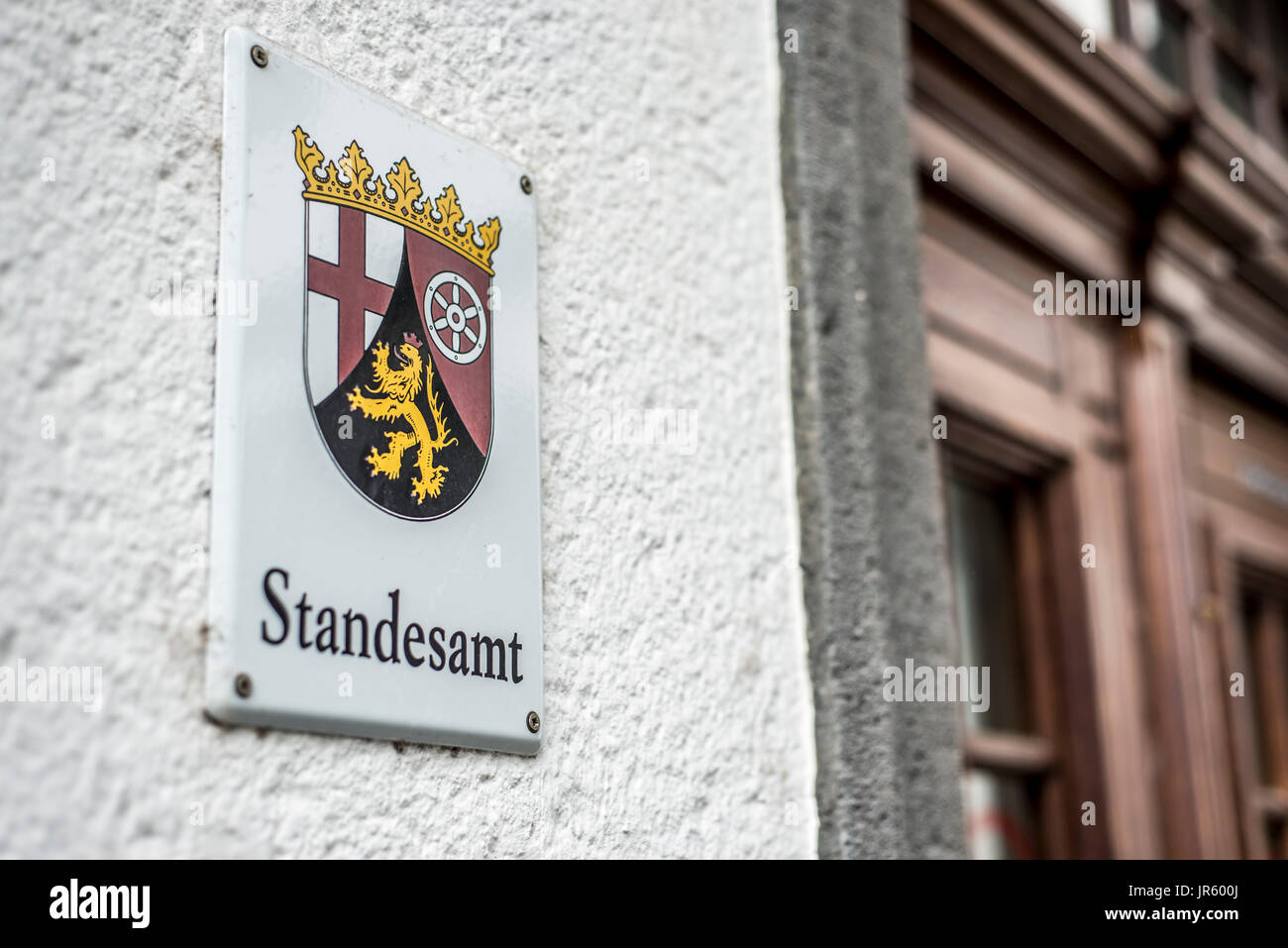 Metal Sign mounted to wall with the German word Standesamt translation register office emblem of the german Region Rhineland Palatino Stock Photo