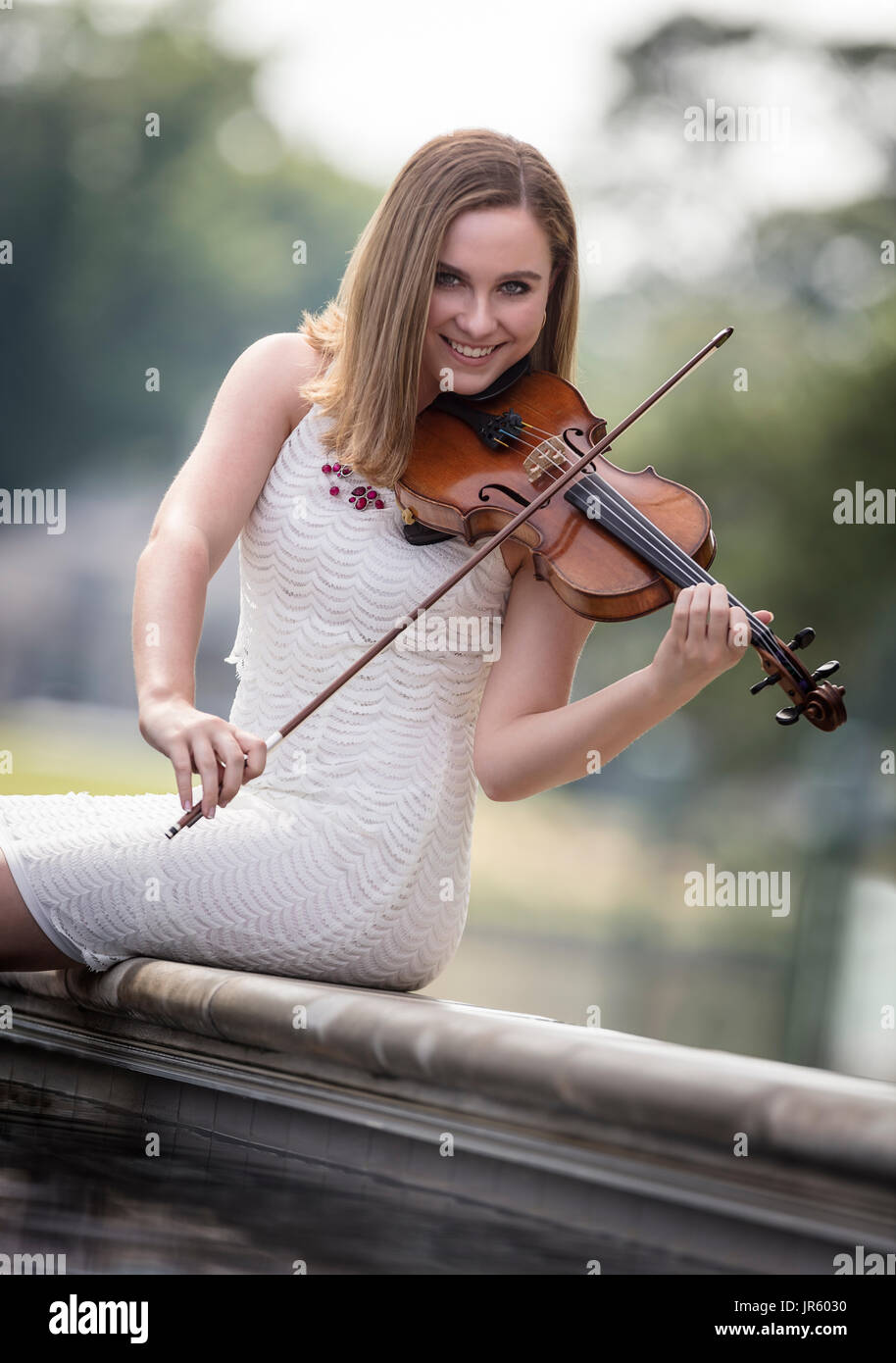 Teenager with her fiddle Stock Photo