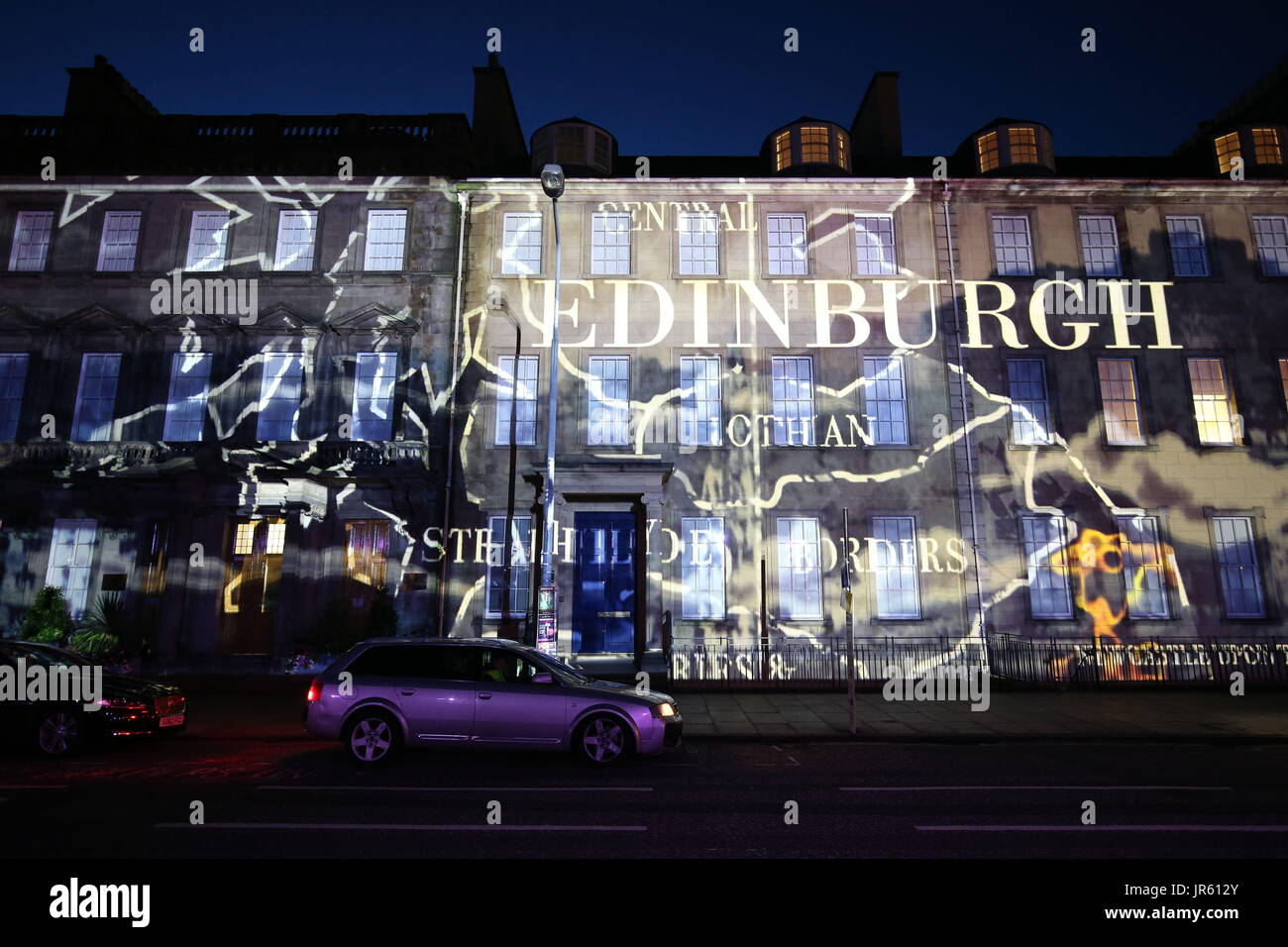 Buildings in St Andrews Square are lit up during the media preview of the Edinburgh International Festival's Standard Life Opening Event: Bloom. Stock Photo