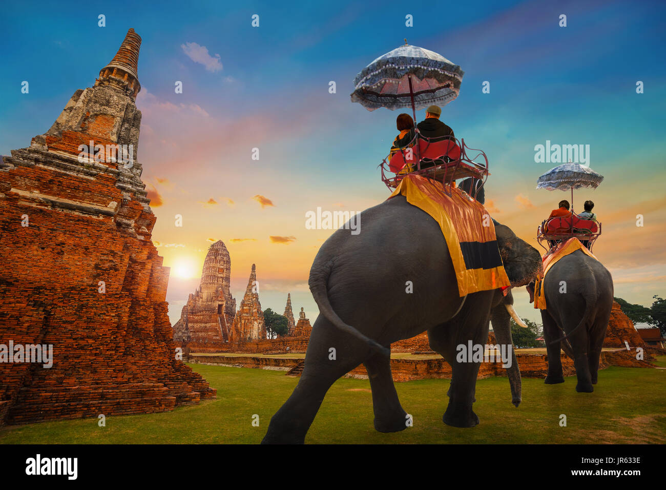 Tourist with Elephant at Wat Chaiwatthanaram temple in Ayuthaya Historical Park, a UNESCO world heritage site, Thailand Stock Photo