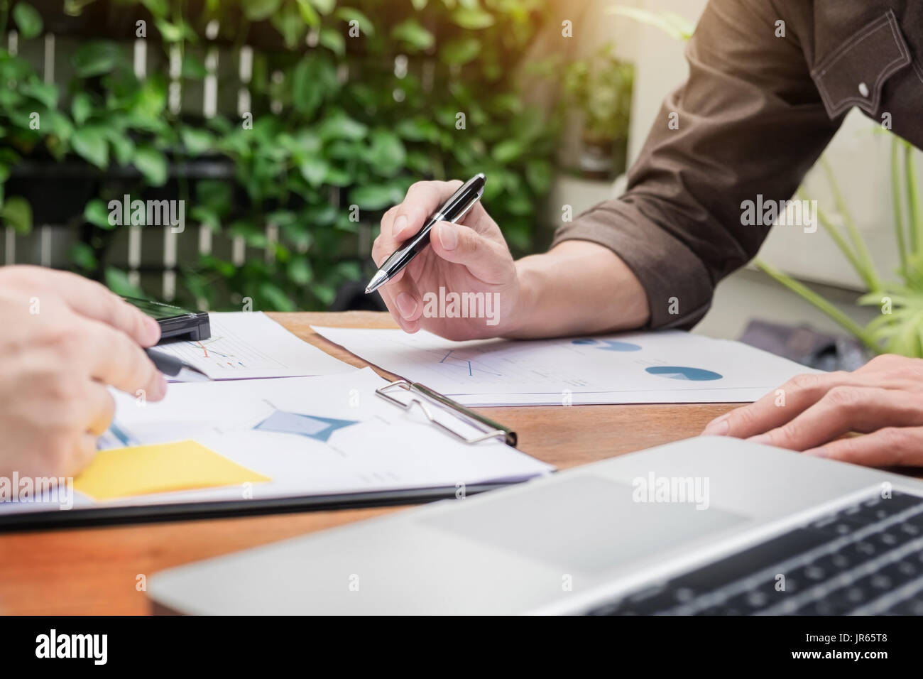 Business meeting  in outdoor. documents account managers crew working with new startup project Idea presentation, analyse marketing plans. Stock Photo
