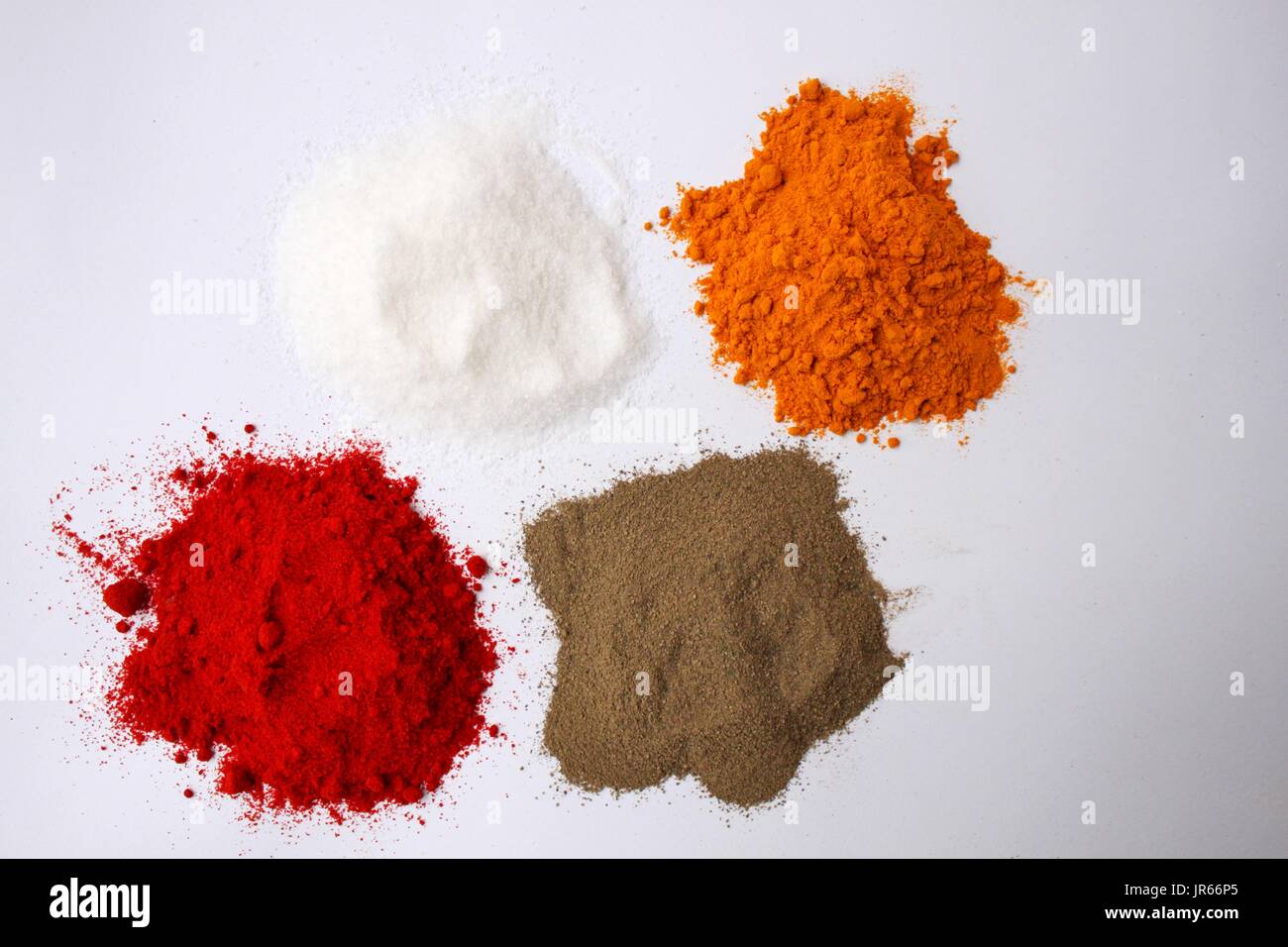 Salt, turmeric, cayenne pepper and ground black pepper Stock Photo Alamy