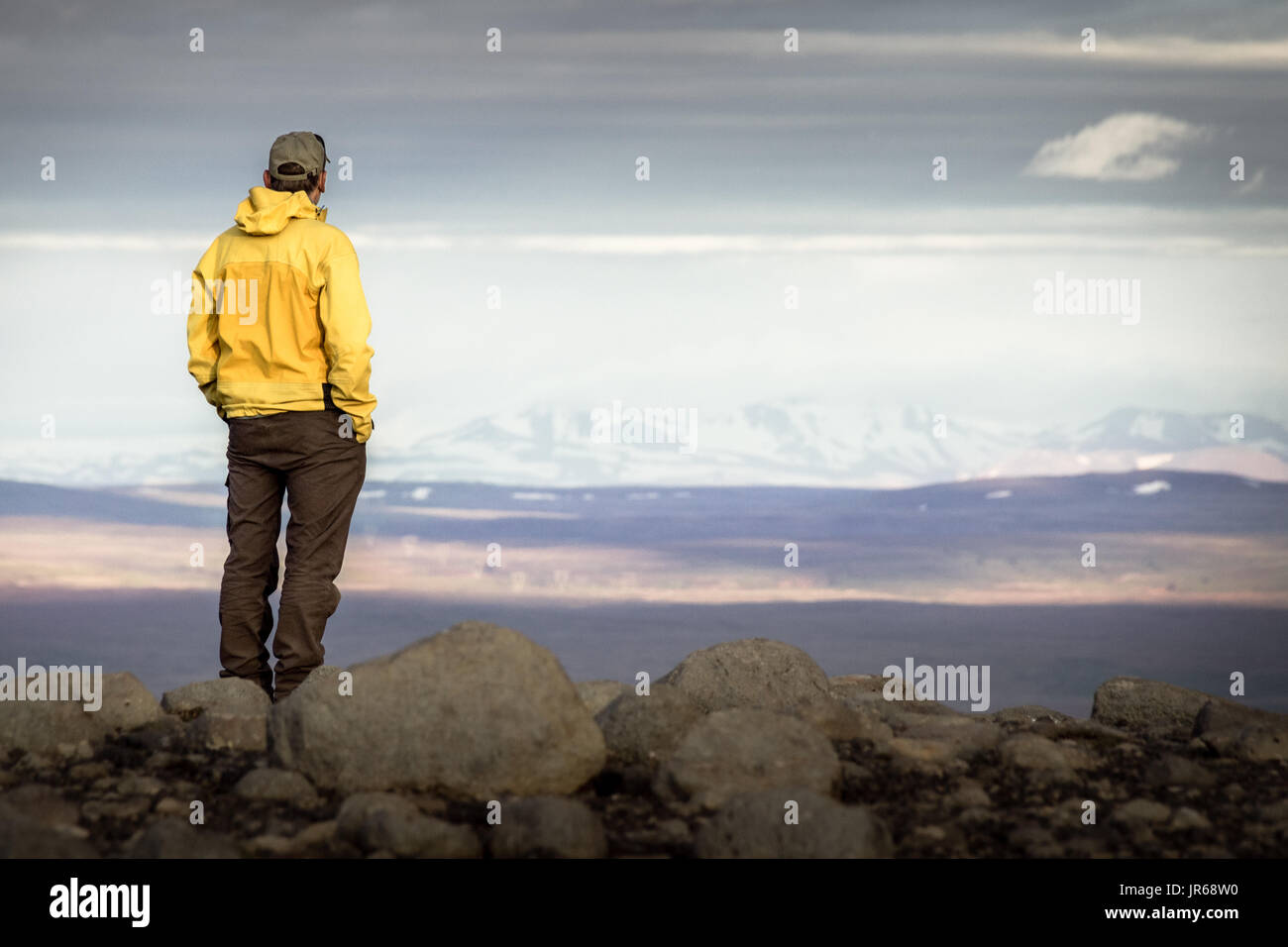 Rear view of man standing on mountain hi-res stock photography and ...