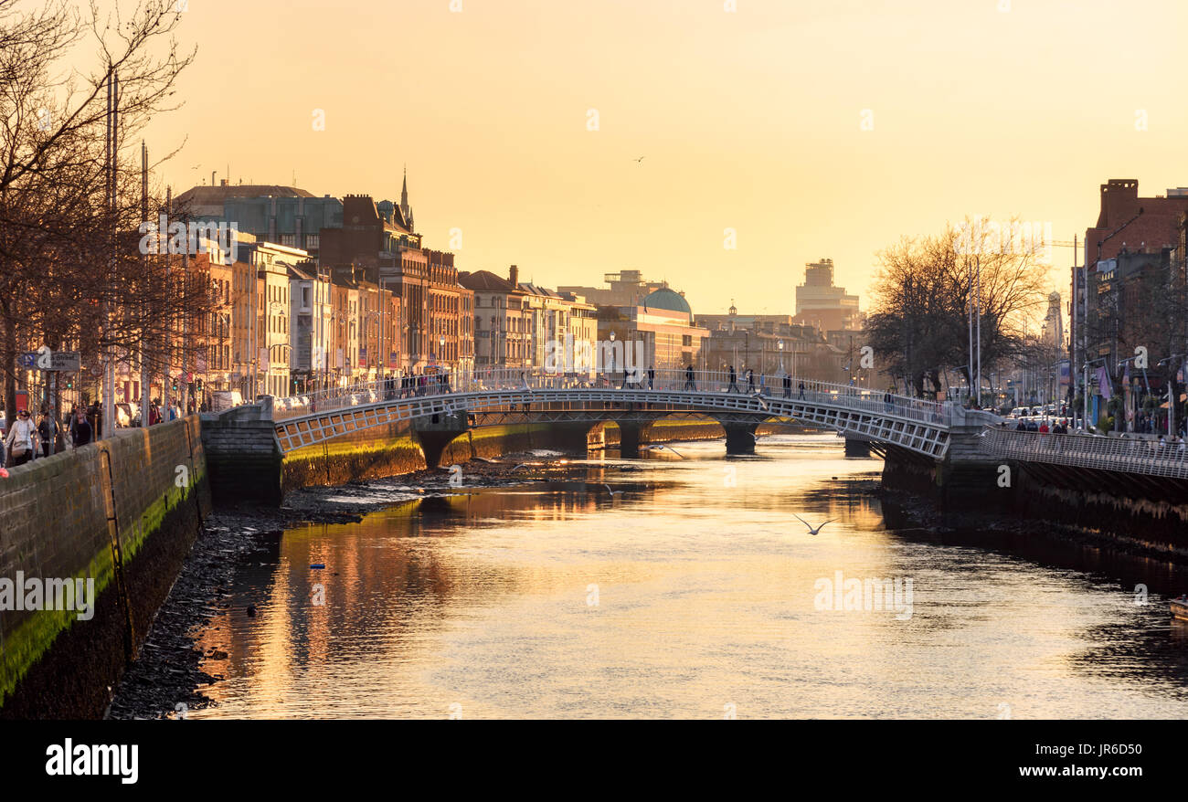 Ha'penny Bridge and the north banks of the river Liffey in Dublin City ...