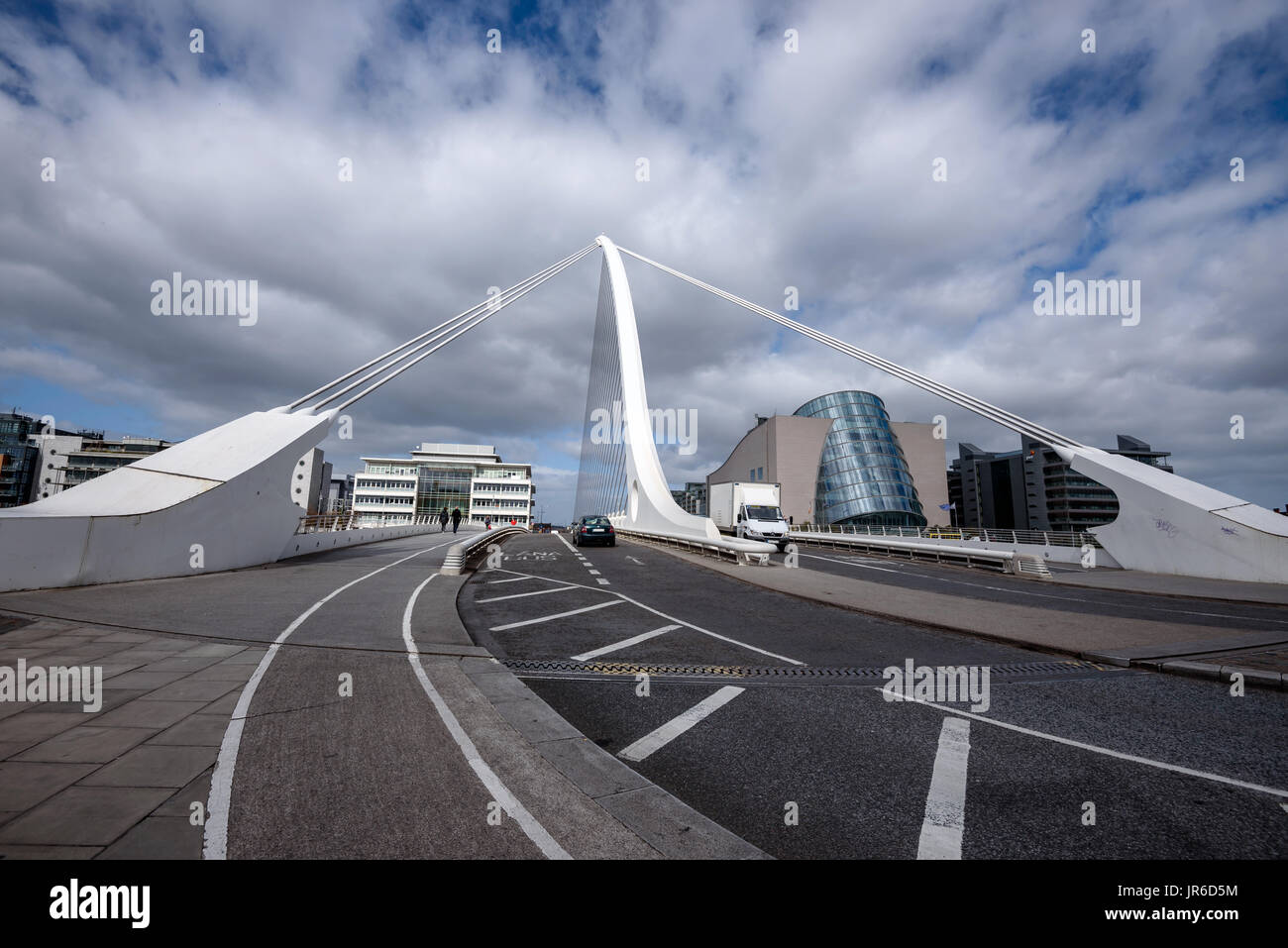 Samuel Beckett bridge in Dublin with car passing through under cloudy sky. Stock Photo