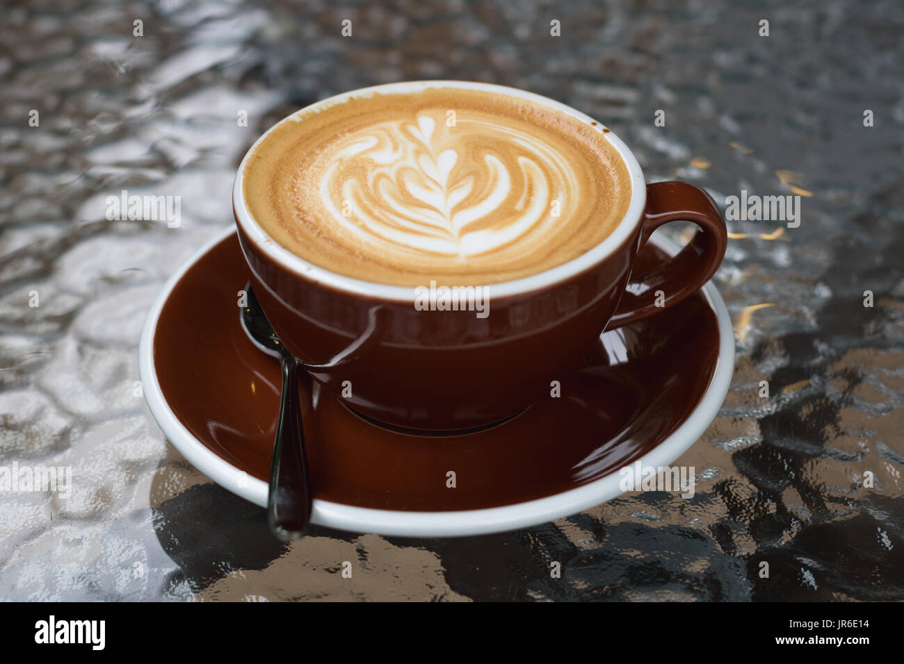 Hot coffee latte with beautiful latte art Stock Photo
