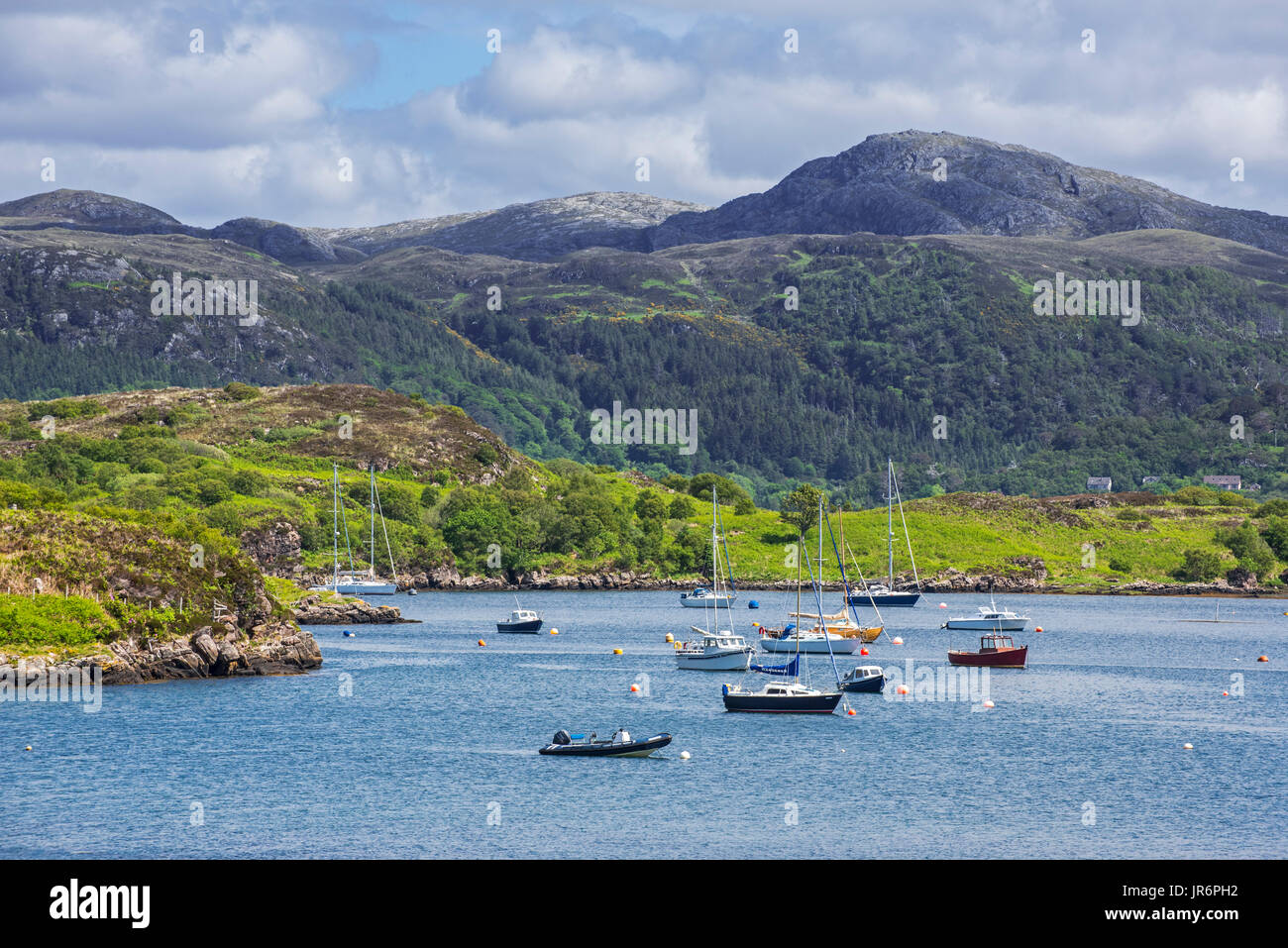 Sailing boats in natural harbour at Badachro near Gairloch on the shore of Gair Loch, Ross and Cromarty, Scotland, UK Stock Photo