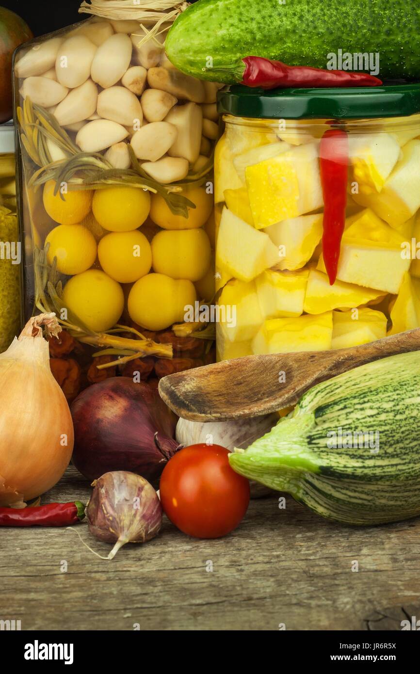 Zucchini slices in herbal vinegar with herbs and filled with canning