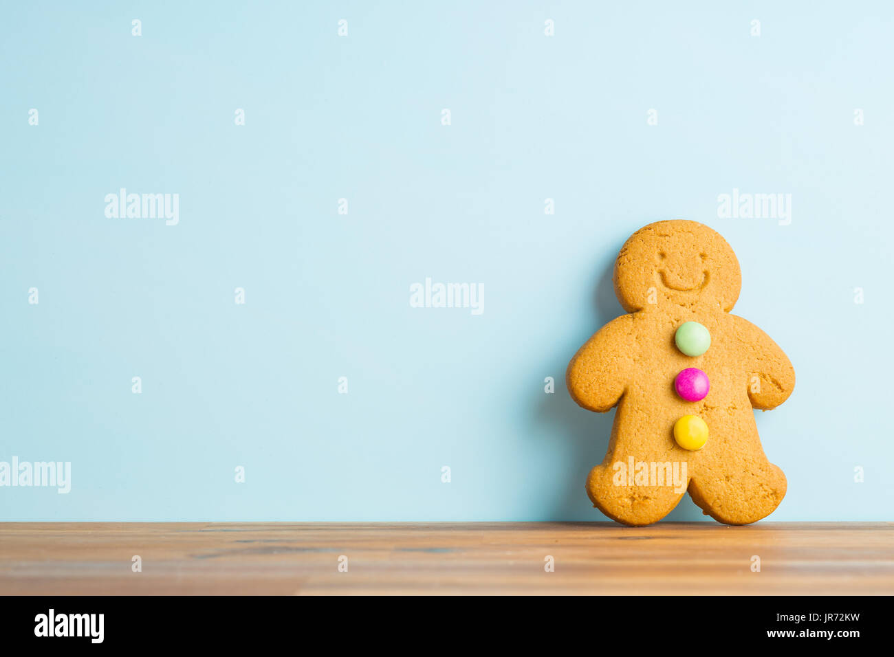 Gingerbread man leaning against the wall. Xmas gingerbread. Stock Photo