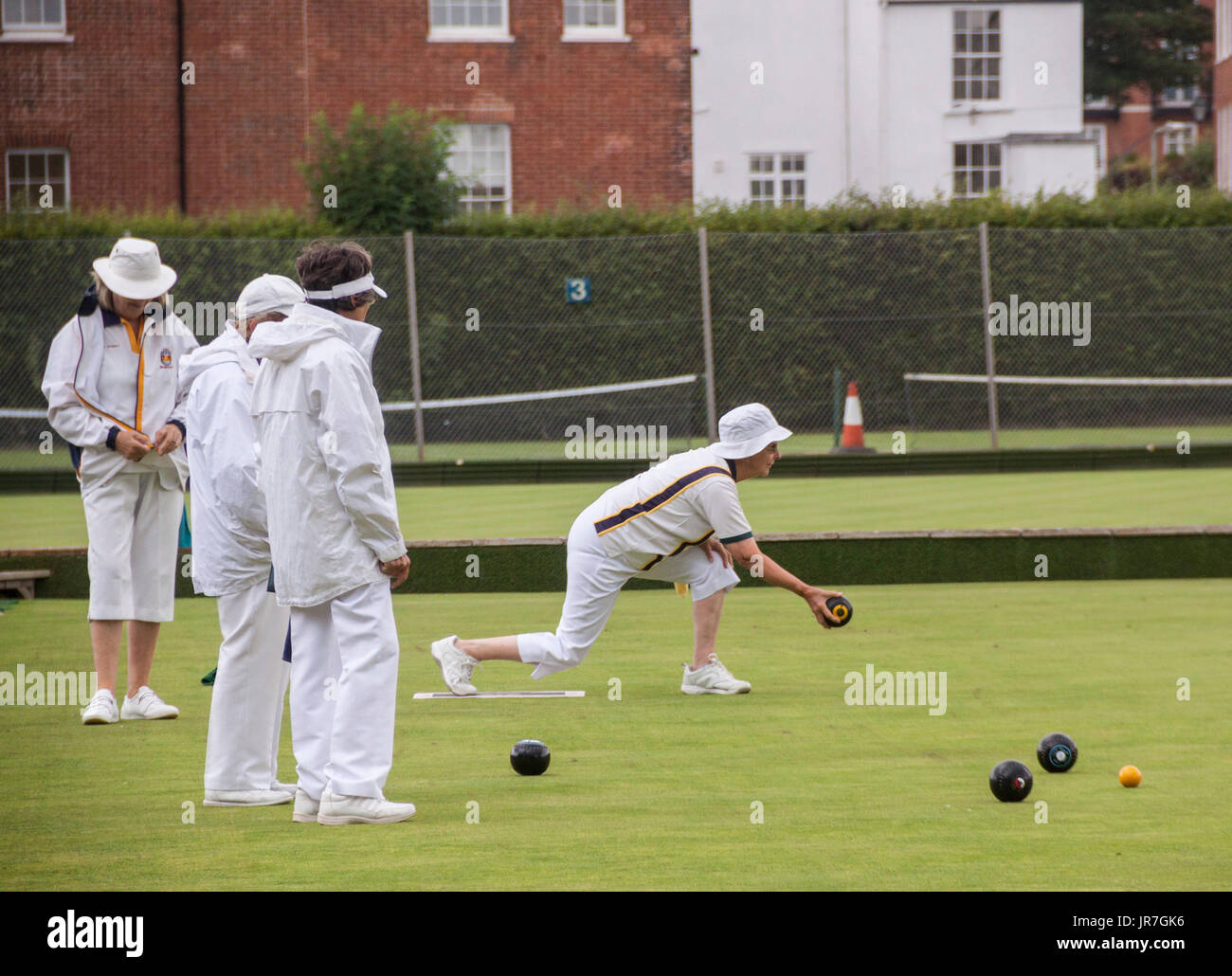 Sidmouth, Devon, UK. 4th Aug, 2017.  Rain doesn't stop play. The ladies at Sidmouth Bowls Club carry on despite the onset of a rain shower. Brighter and drier conditions are forecast for the South West over the weekend. Credit: South West Photos/Alamy Live News Stock Photo