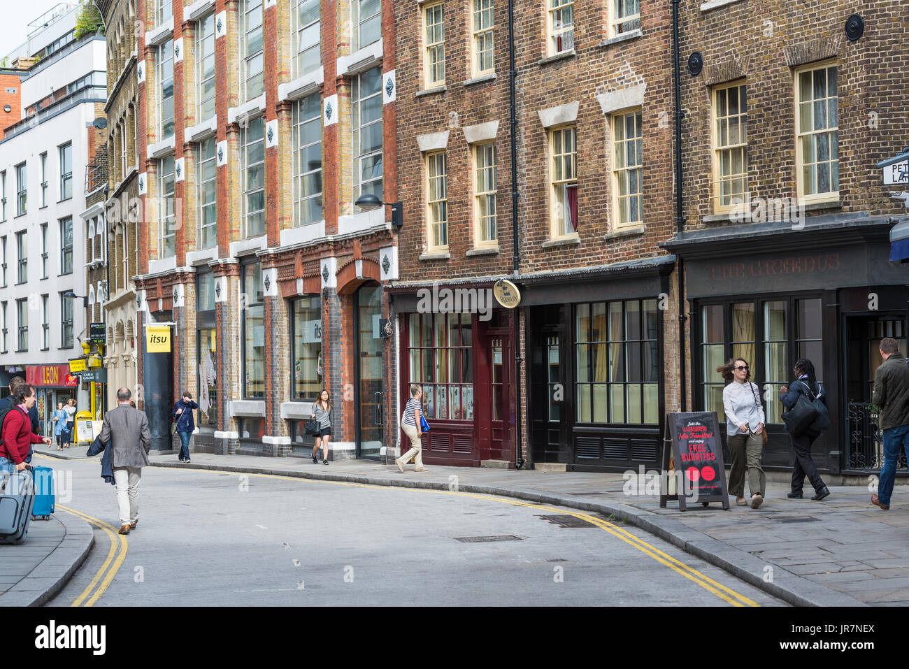 Street scene in Cowcross Street, Farringdon, London, England UK Stock Photo