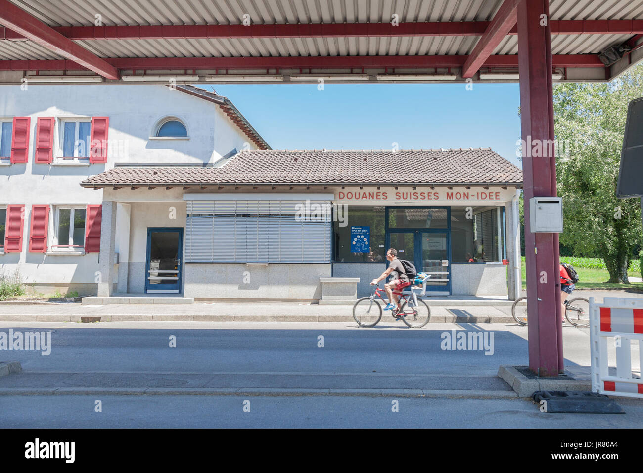 MON IDEE, SWITZERLAND - JUNE 18, 2017: People entering Switerland from France in Mon Idee, an abandoned border crossing from the Swiss Customs, closed Stock Photo