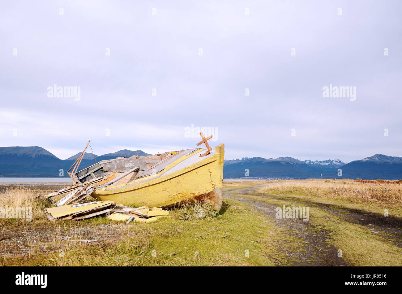Old wooden boat abandoned ashore Stock Photo - Alamy