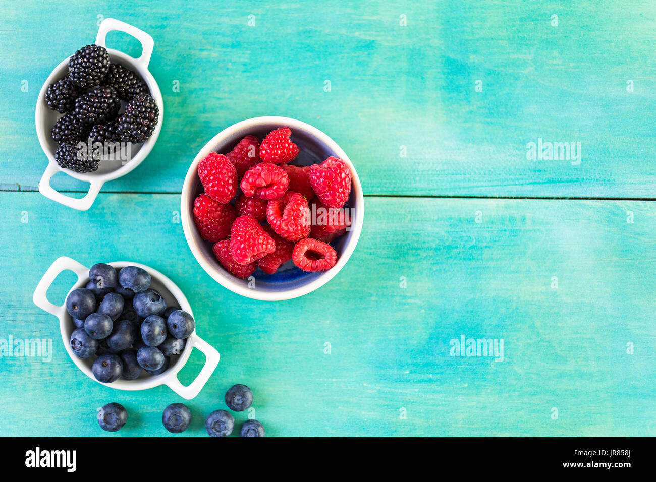 Making fresh fruit ice cubes for summer drink. Stock Photo