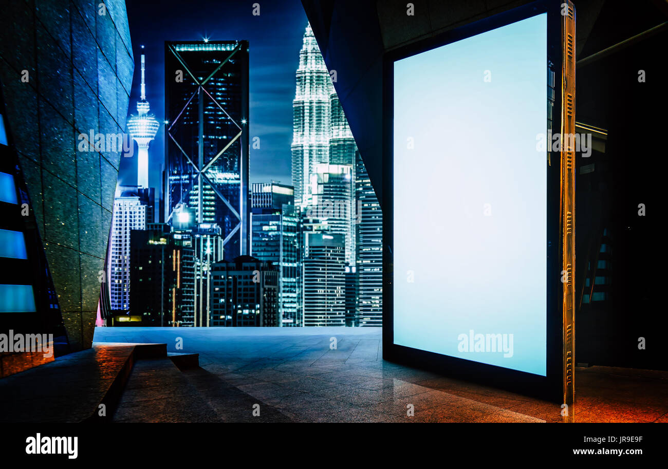 Big empty screen billboard with modern city background . Stock Photo