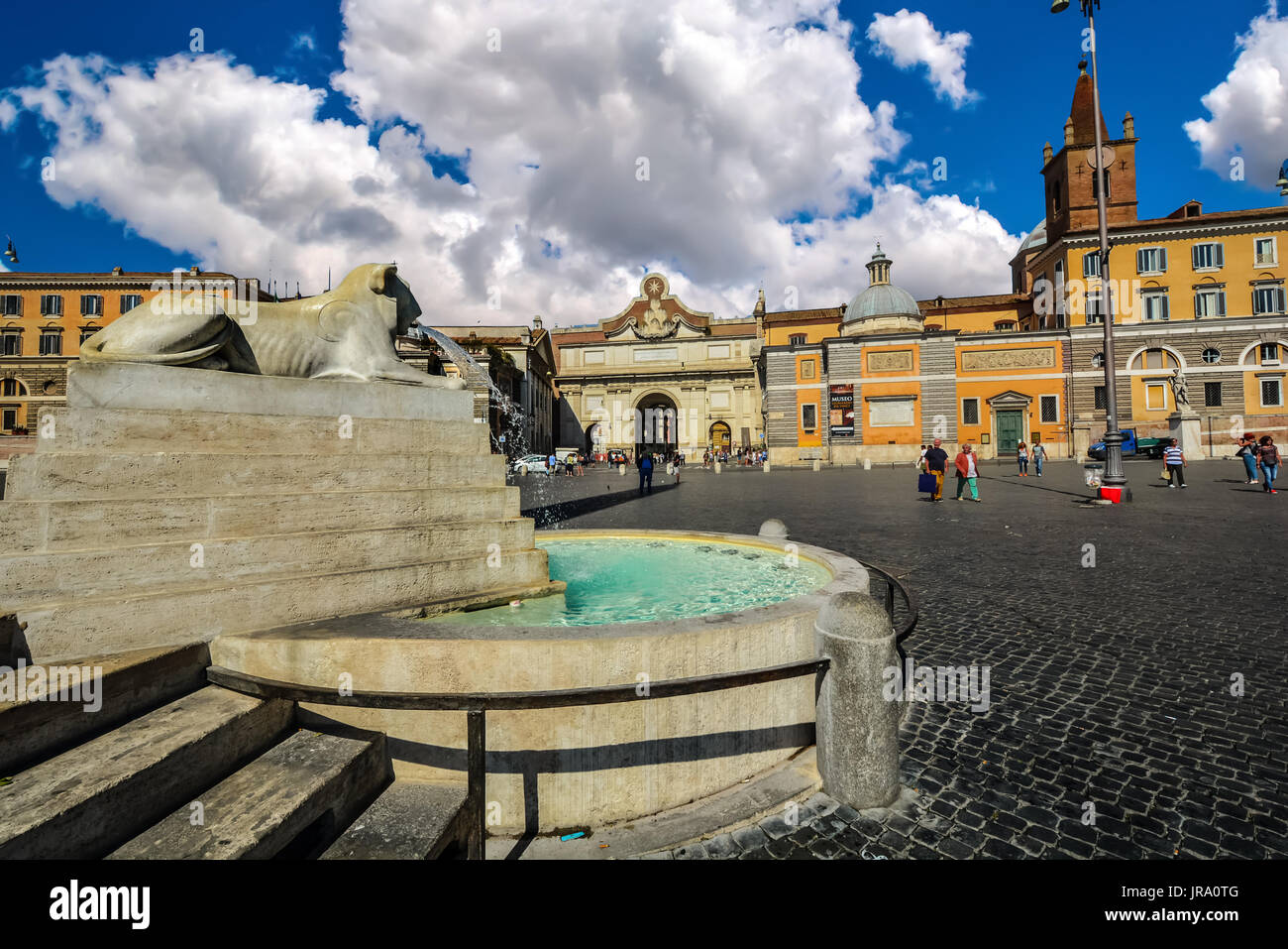Lion fountain or Fontana Dei Leoni In Piazza Del Popolo on a sunny, partly cloudy day in Rome