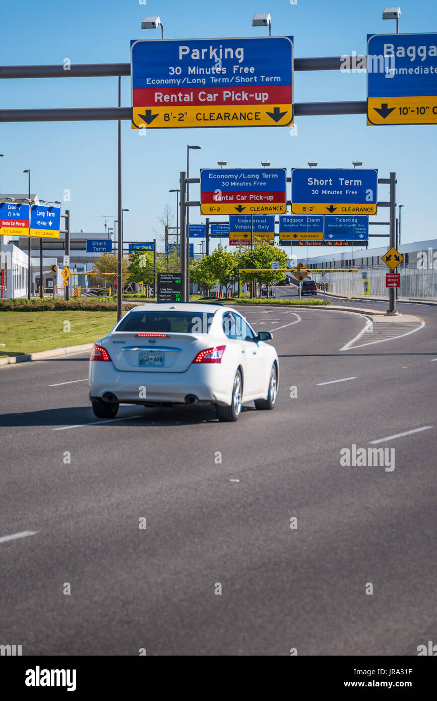 Airport parking and rental car signage over the entry lanes at Memphis International Airport in Memphis, Tennessee, USA. Stock Photo