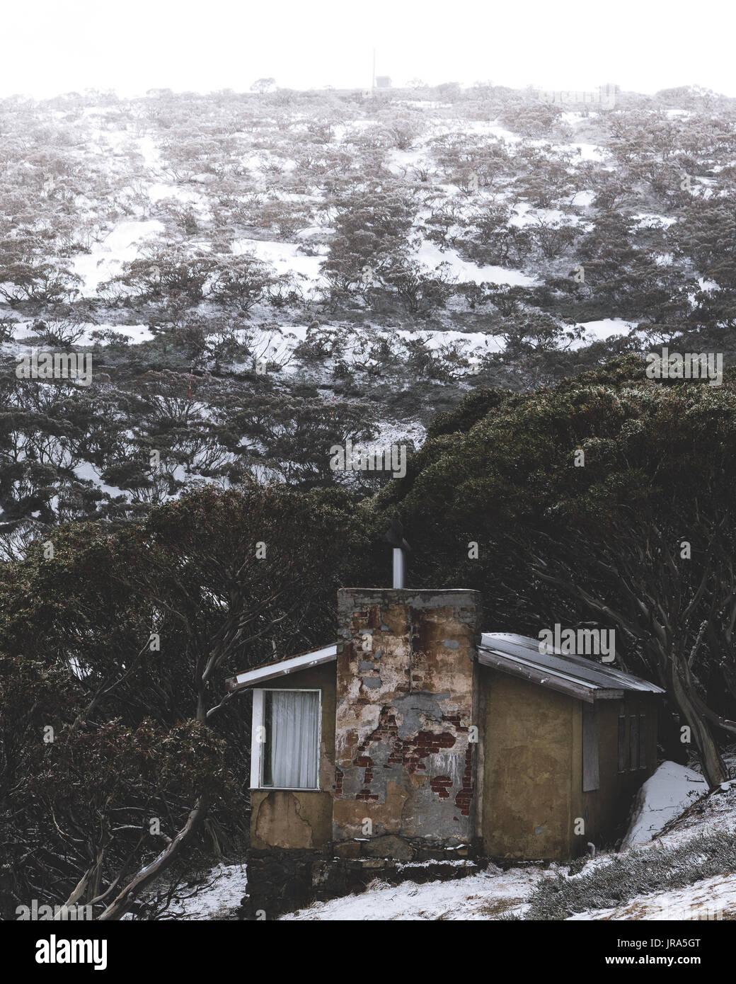 Abandoned house on the way up to Mount Hotham covered in snow. Stock Photo