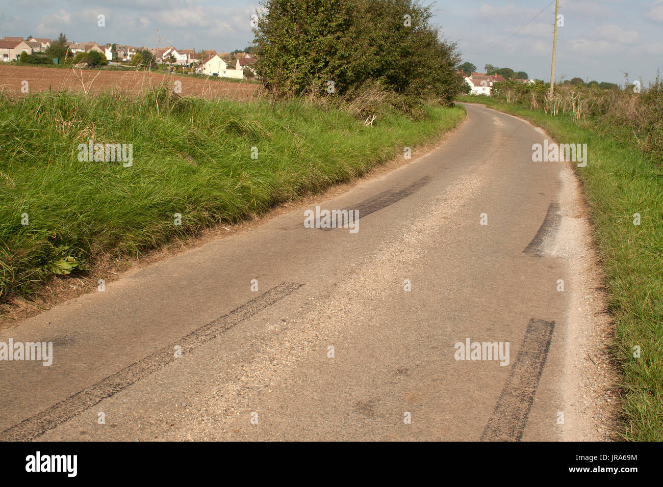 Car rubber tire skid marks left by young drivers going too fast in a