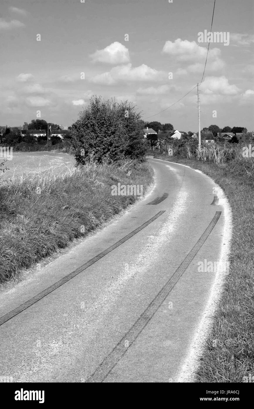 Car rubber tire skid marks left by young drivers going too fast in a