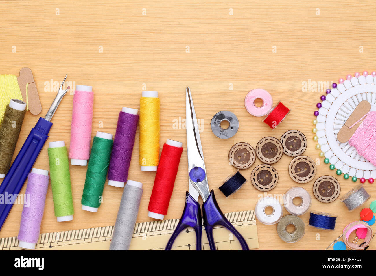 sewing tools, tailoring and fashion concept - close-up on wooden table Stock Photo