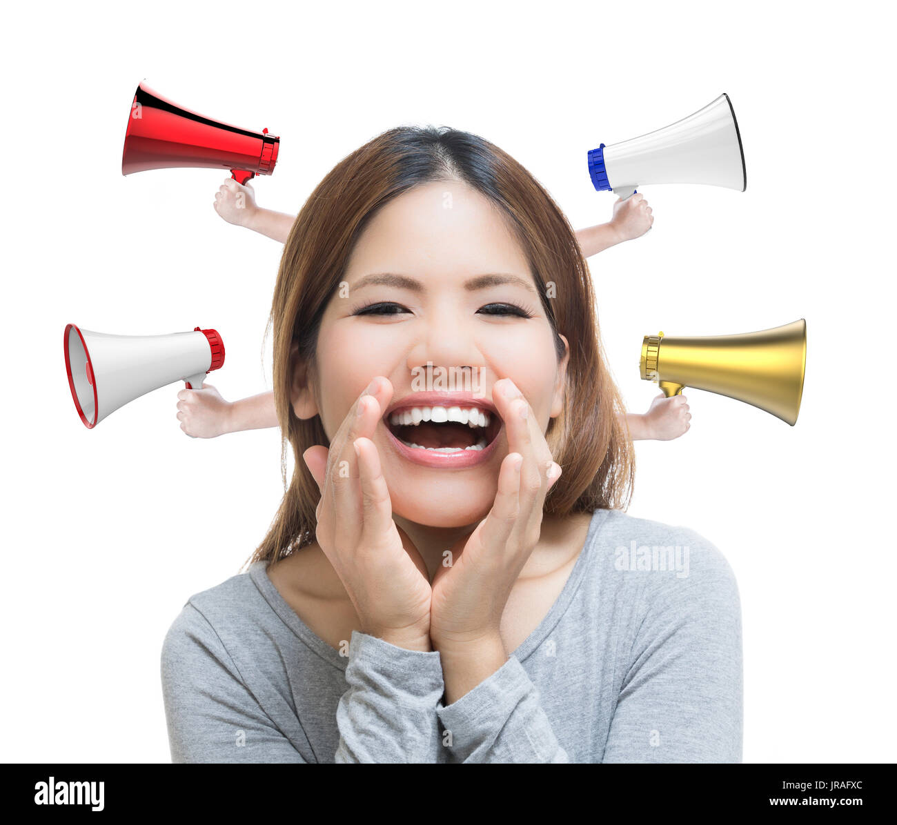 asian woman telling good news with megaphones on white background Stock Photo