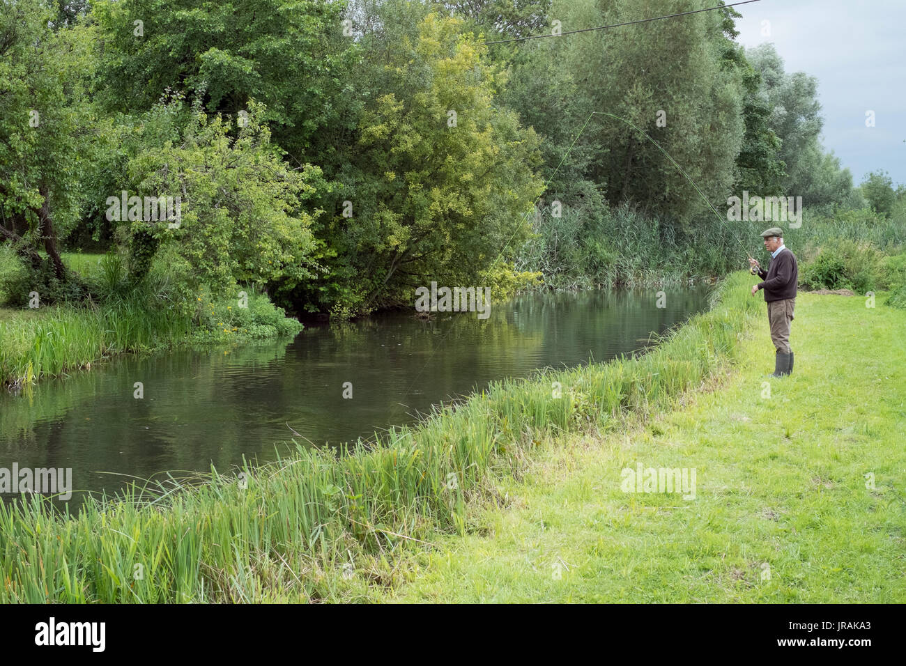 Fly fisherman fishing on the river Test, Wherwell Trout Fishery