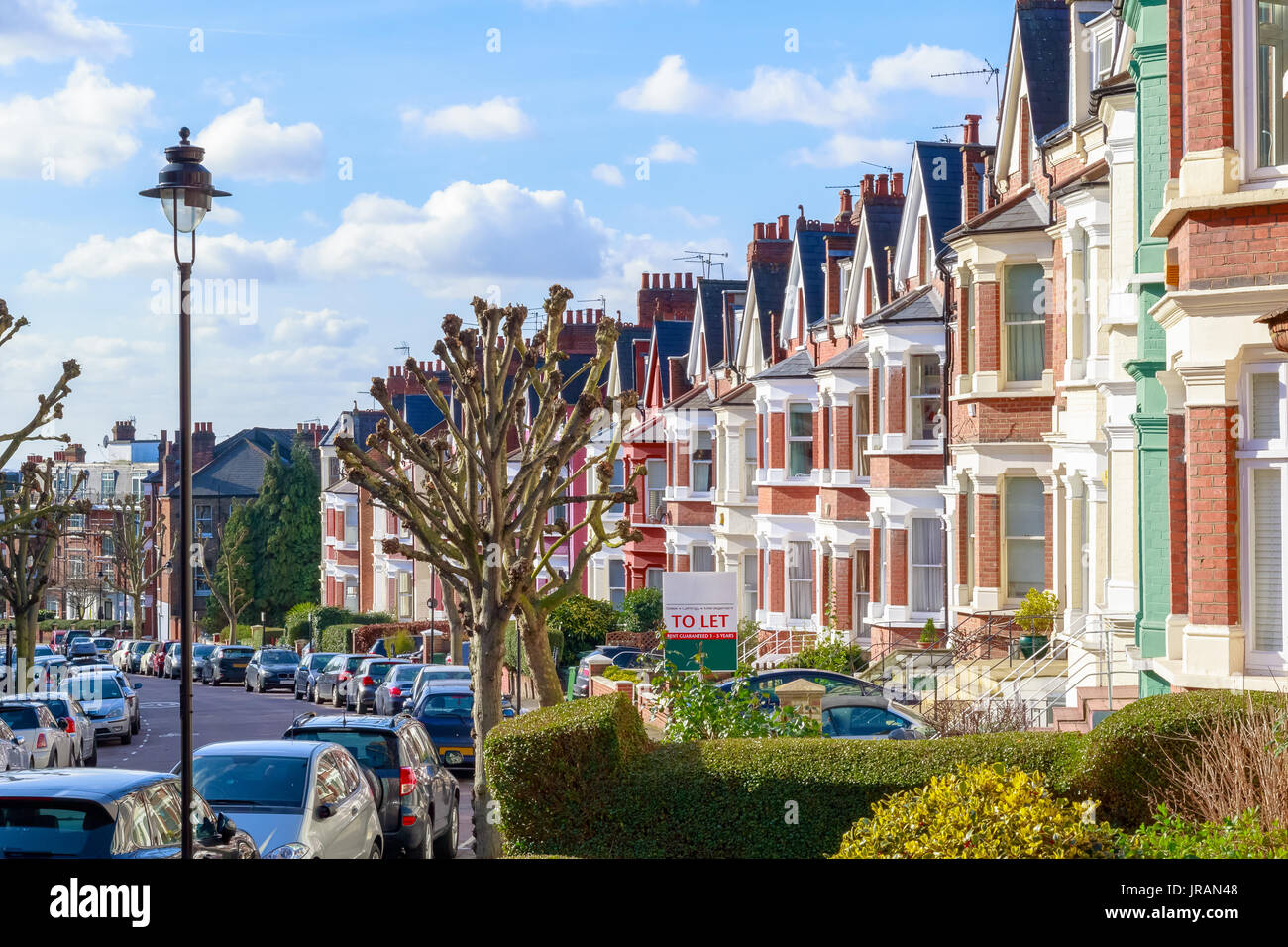 Row of typical English terraced houses in West Hampstead, London Stock Photo