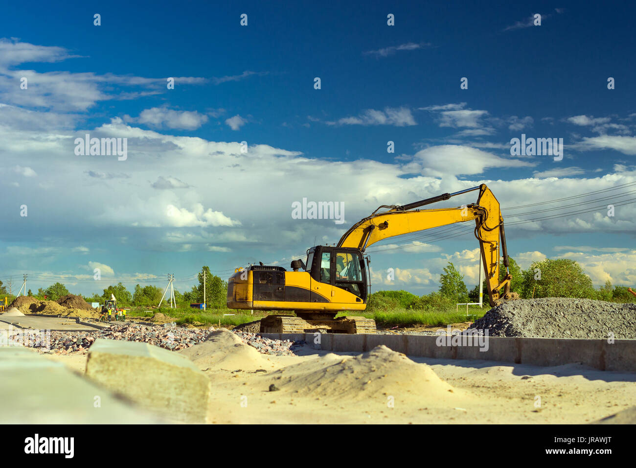 Crawler Excavator digging bucket on construction of high-speed bypass road around Krasnoe Selo, Saint Petersburg. Heavy machine equipment for excavati Stock Photo