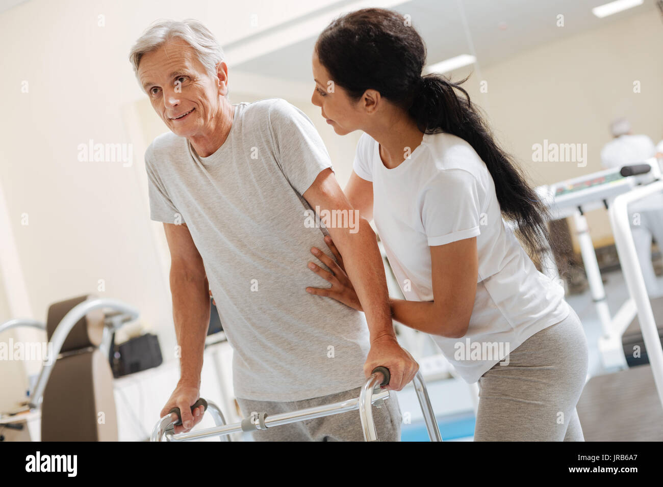 Resolute pensioner leaning on his support Stock Photo