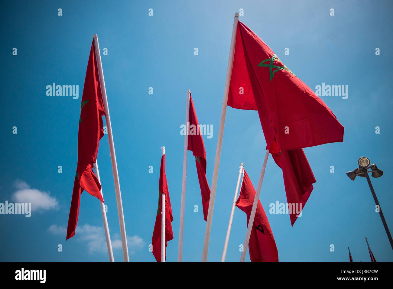 low angle view of moroccan flags against sky - Casablanca - Morocco Stock Photo