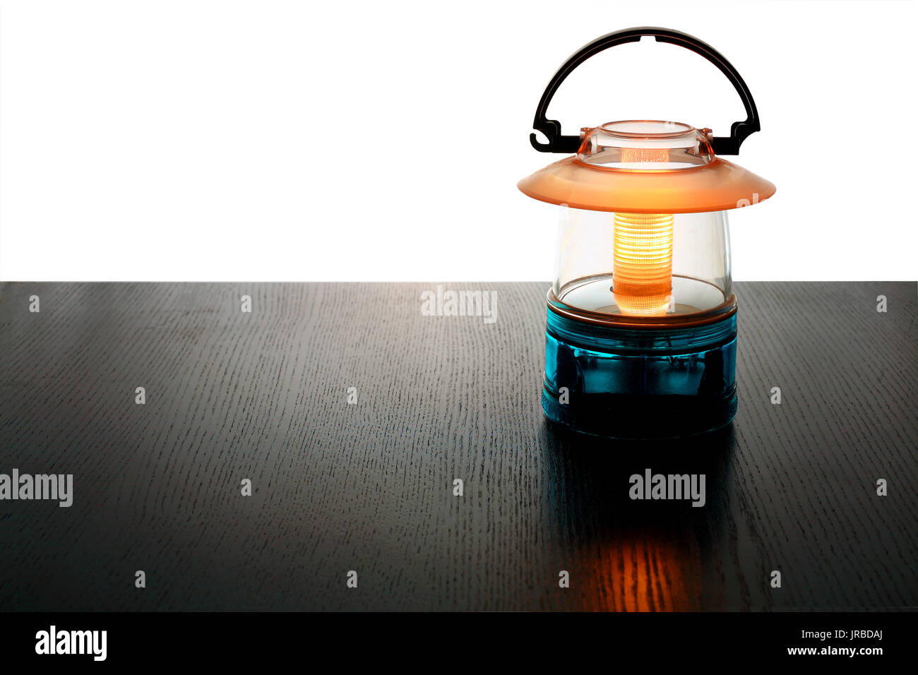 Camping Lantern on Wooden Background Stock Photo