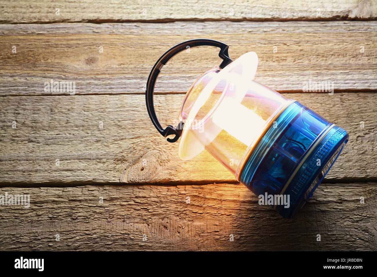 Camping Lantern on Wooden Background Stock Photo