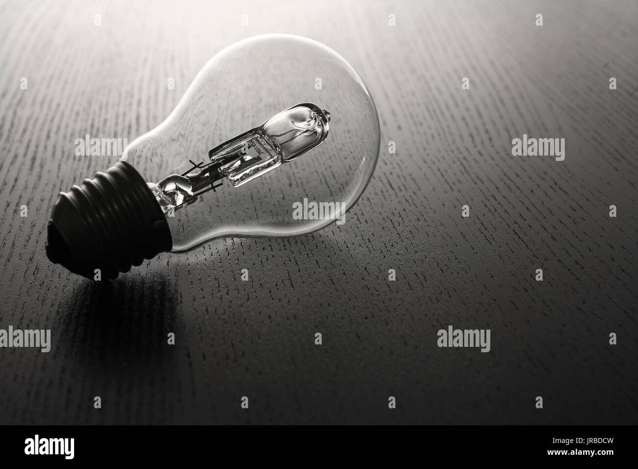 Lightbulb on Wooden Background Stock Photo