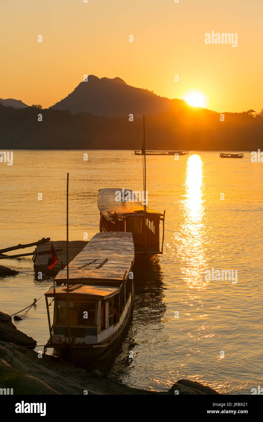 Boats on the Mekong river, Luang Prabang, Laos Stock Photo